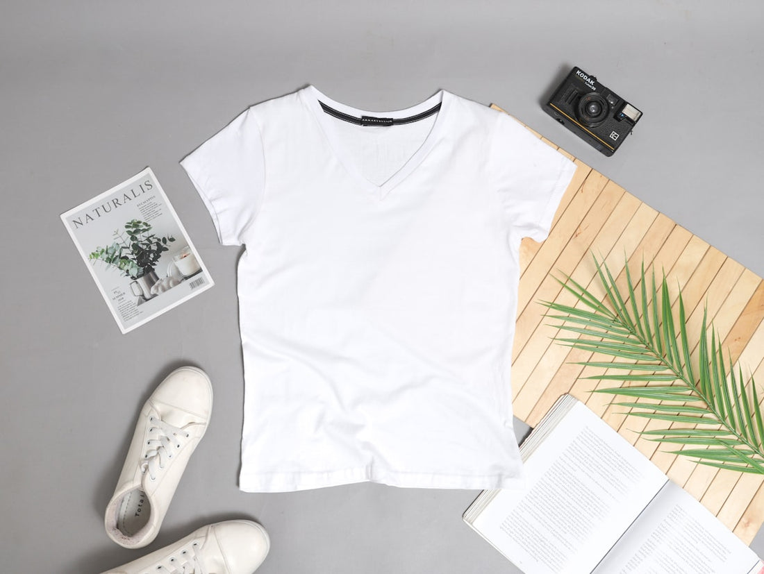 print-on-demand vs custom manufacturing — white t-shirt flatlay mockup with accessories